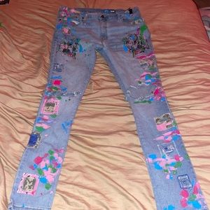 Ripped Patched, painted, and distressed Jeans. Size 36x32.